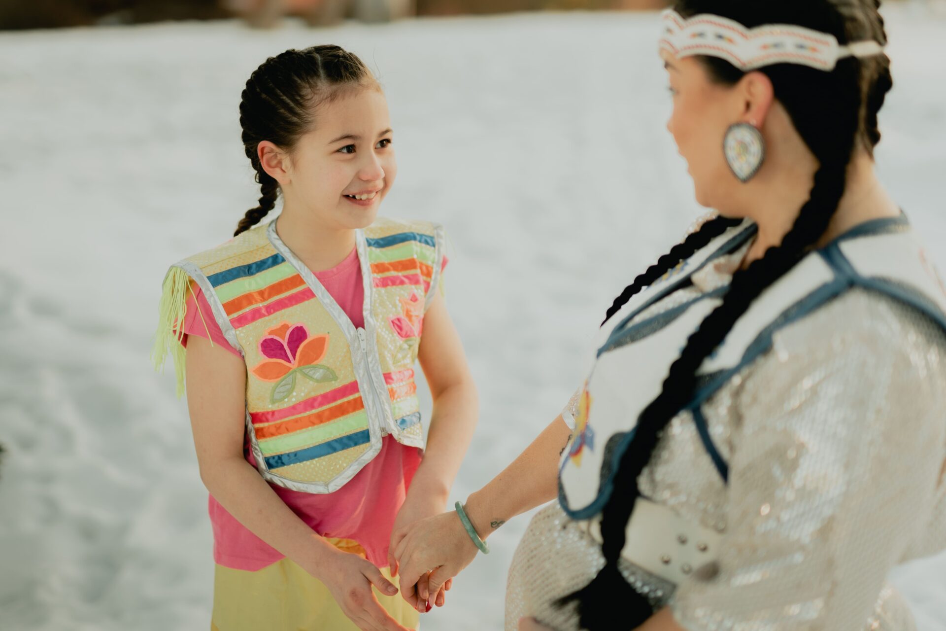 foster parent and child looking at one another smiling