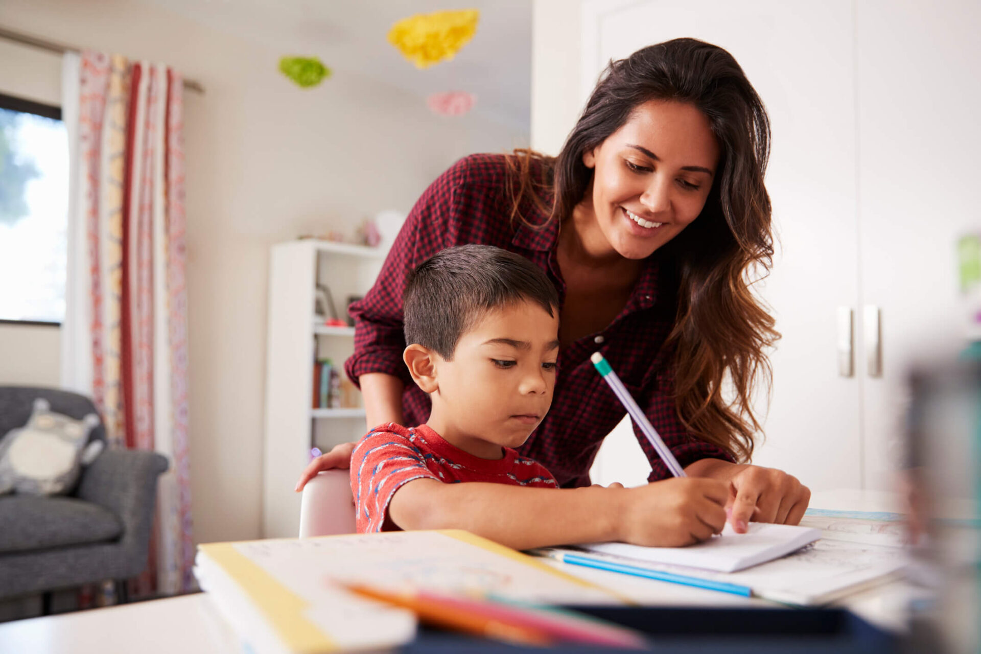 foster parent helping child with school work