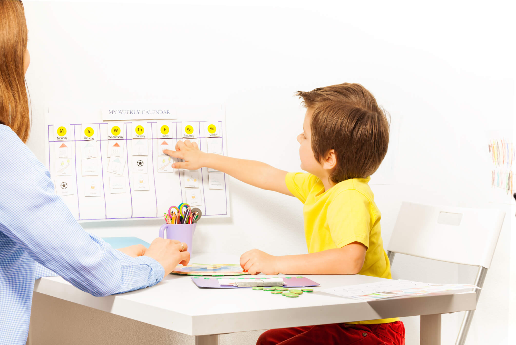foster parent helping child with days of the week